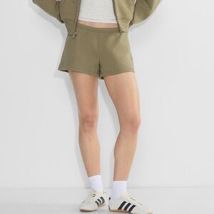 Aritzia cozy sweatfleece boyfriend low rise mini shorts in olive
